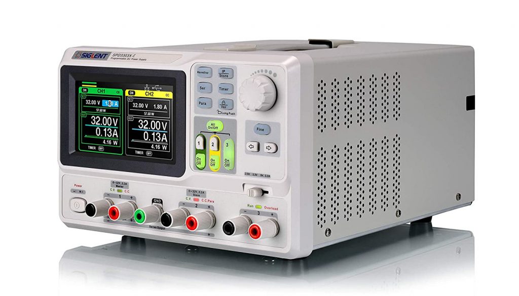 Front view of a SIGLENT SPD3303X-E benchtop DC power supply showing set intensity and voltage for its two main channels.